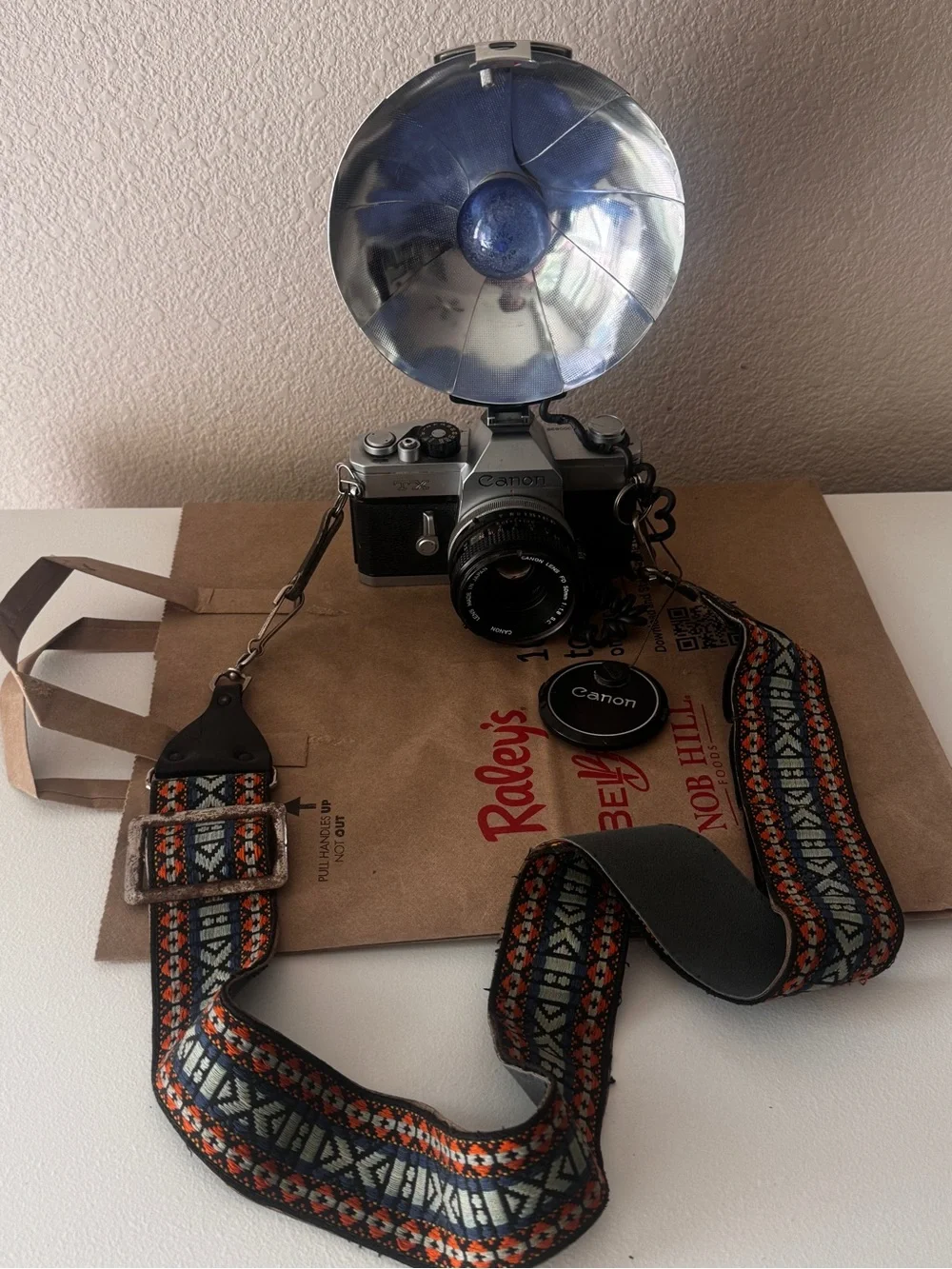 Canon Film Camera with Blue Flash Reflector and Patterned Orange-Accent Strap